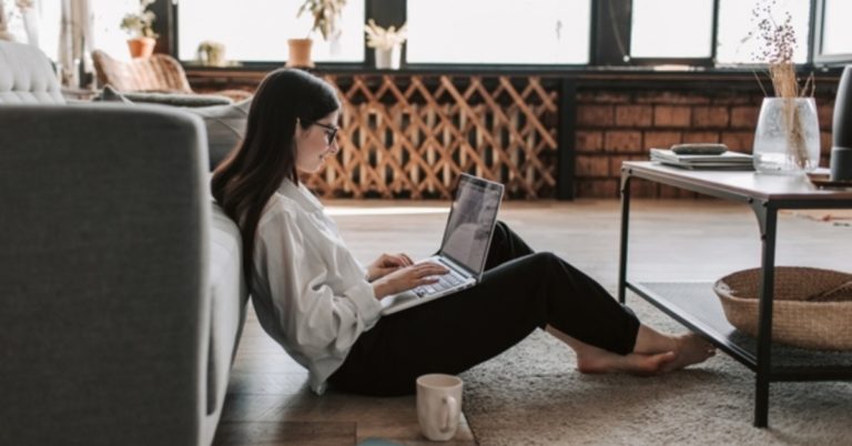 Typing on a laptop computer.