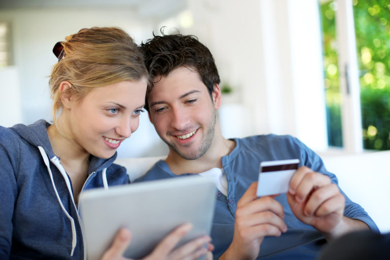 Happy,Young,Couple,Doing,Shopping,On,Internet